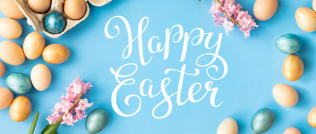 Bright easter eggs with happy Easter lettering, holiday concept. Selective focusの写真素材