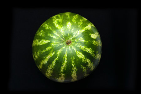 Fresh watermelon isolated on a black background, top viewの写真素材