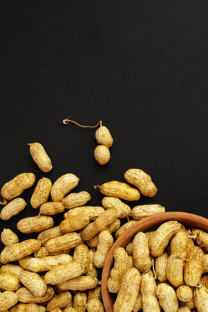 Roasted peanuts, peanuts in shell Isolated on black background