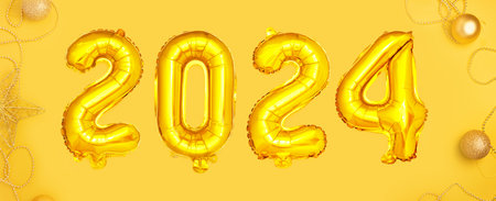 Golden foil balloons with the number 2024.の写真素材