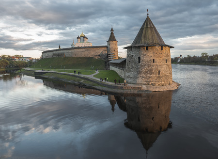 Pskov Kremlin at the confluence of two rivers the Great and Pskov at sunset.のeditorial素材