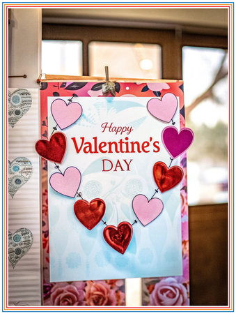 valentine's day greeting card with red hearts hanging on clothesline