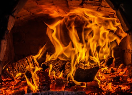 open fire in the furnace, burning firewoodの写真素材
