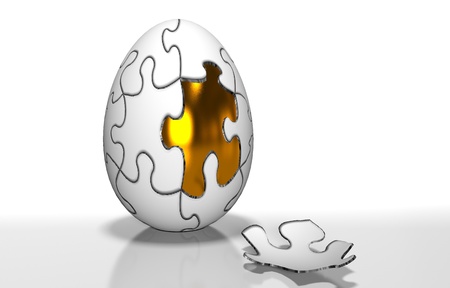 A gold egg is in the broken shellの写真素材