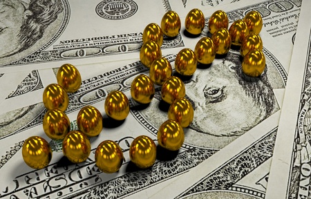 A gold egg is in the broken shellの写真素材