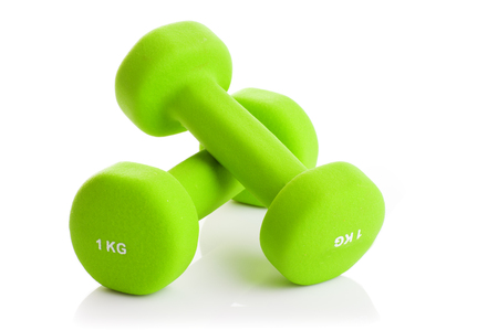 Two green dumbbells on a white backgroundの写真素材