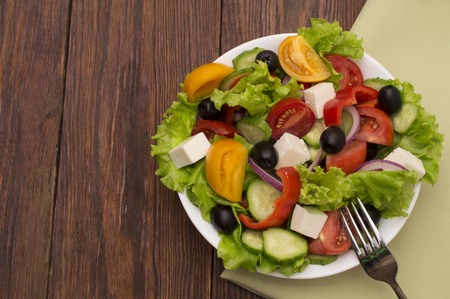 fresh vegetable salad isolated on white backgroundの写真素材