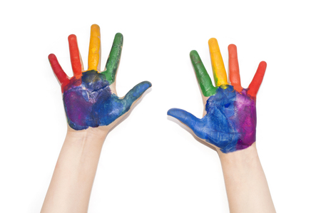 Childrens hands painted with colorful paint.の写真素材