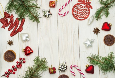 Christmas composition. Gift, christmas decoration, cypress branches, pine cones. Flat lay, top view, copy spaceの写真素材