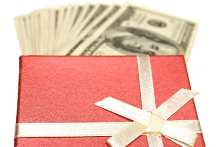 gift box and dollars on white. closeup