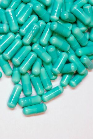 many green medicine pills. closeup
