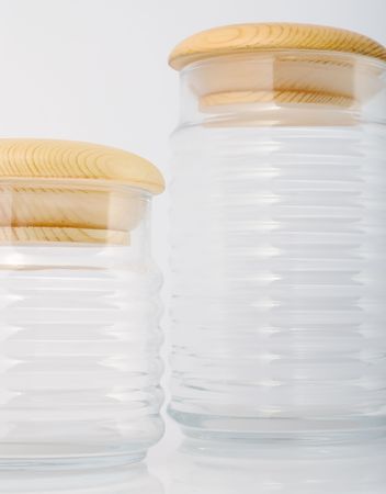 glass jars covered wooden lidsの写真素材