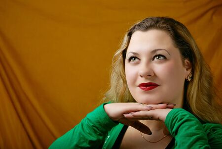 portrait of attractive girl on yellow backgroundの写真素材