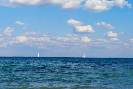 sea landscape with silhouette of a shipの写真素材