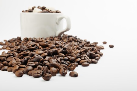cup with coffee beans and sugar. closeupの写真素材