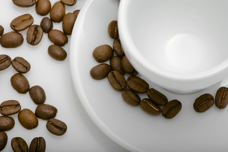 empty cup of coffee with coffee beansの写真素材