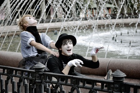 two mimes at fountain. pantomimeの写真素材