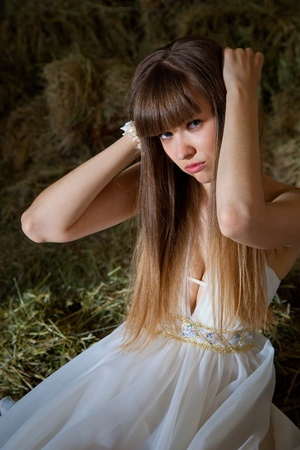 attractive girl in the hay. rural portraitの写真素材