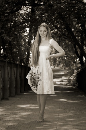 attractive girl walking on bridge. olutdoor shotの写真素材