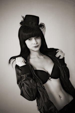 portrait of attractive young woman in black hatの写真素材
