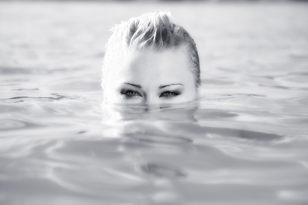 summer portrait of attractive woman in waterの写真素材
