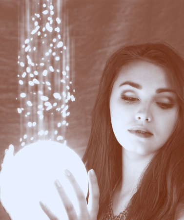 lighting sphere in hands. attractive fairy girlの写真素材