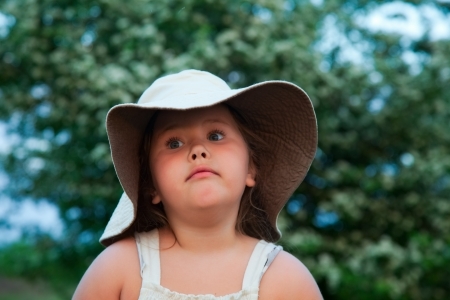 portrait of attractive young girl in big hat. outdoorの写真素材