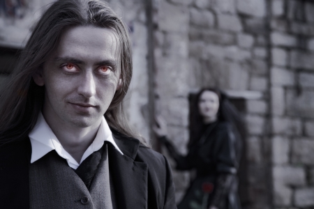 young man in old style suit and young womanの写真素材