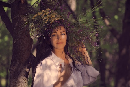 wreath of flowers on head of girl  outdoor shot