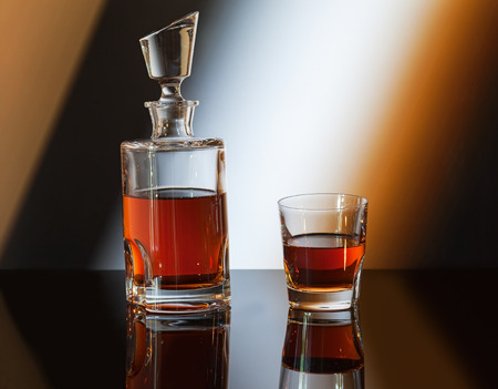 whiskey bottle on abstract backgroundの写真素材