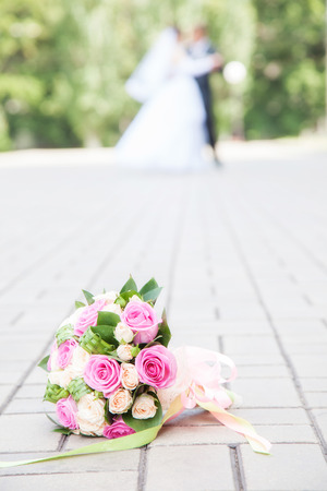 bouquet on the floor. against the background of newlyweds danceの写真素材