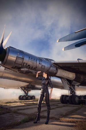 portrait of attractive woman near aircraftsの写真素材