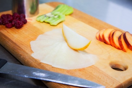 slises of fruit on boardの写真素材