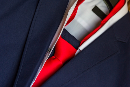 men's blue suit and red tieの写真素材