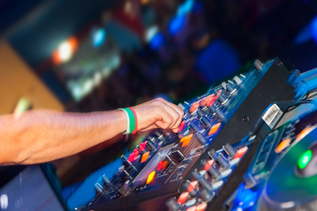 DJ hands on the remote. nightclubの写真素材