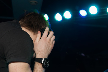 guy with headphones on background spotlightsの写真素材
