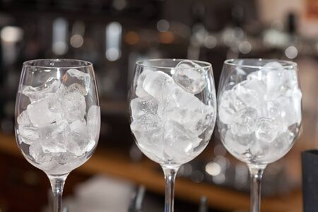 Glass with ice cubes closeup