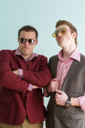 two guys with glasses and retro costumes. portraitsの写真素材