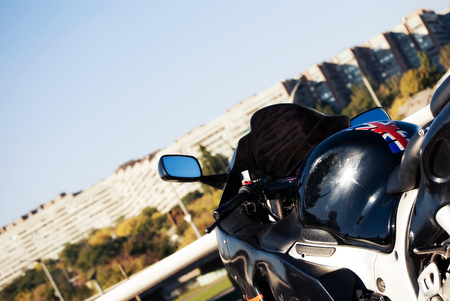 shiny handlebar motorbike tank and on the background of the road. close-up