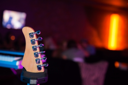 part of guitar in club