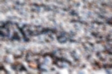 defocused background sea pebbles. bokehの写真素材
