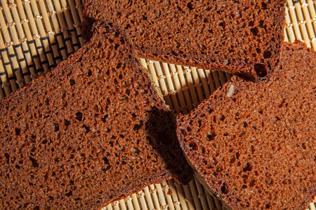 Black sliced bread on the table. close-up