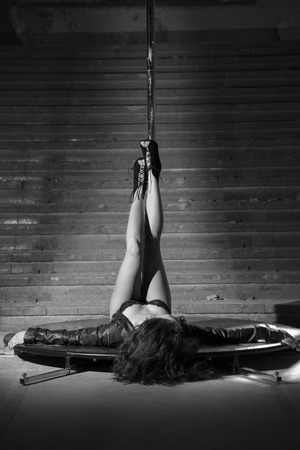 Beautiful brunette dancing on a poleの写真素材