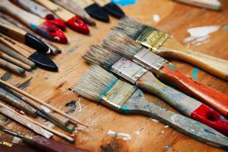 old brush for drawing on a table. Still authentic, the artist's toolsの写真素材