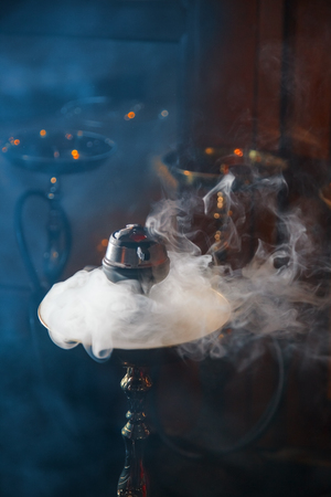 Beautiful smoke in the bowl of a hookah. close-up