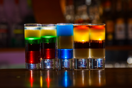 Colorful alcohol  shot drinks on bar. cocktailの写真素材