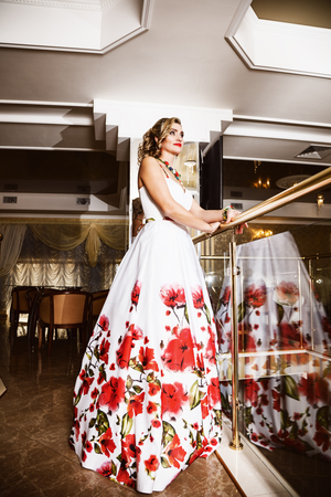 Portrait of attractive blonde woman in formal dressの写真素材