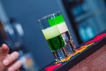 Preparation of shots cocktails. Close-upの写真素材