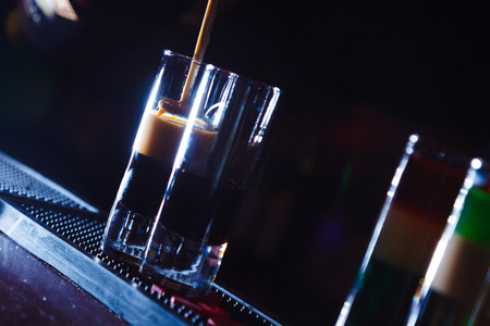 Preparation of shots cocktails. Close-upの写真素材