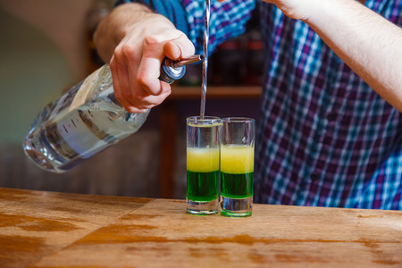 Preparation of shots cocktails. Close-upの写真素材